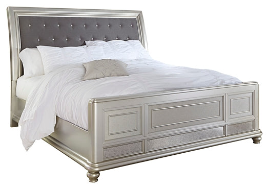 Coralayne King Upholstered Sleigh Bed with Mirrored Dresser and Chest